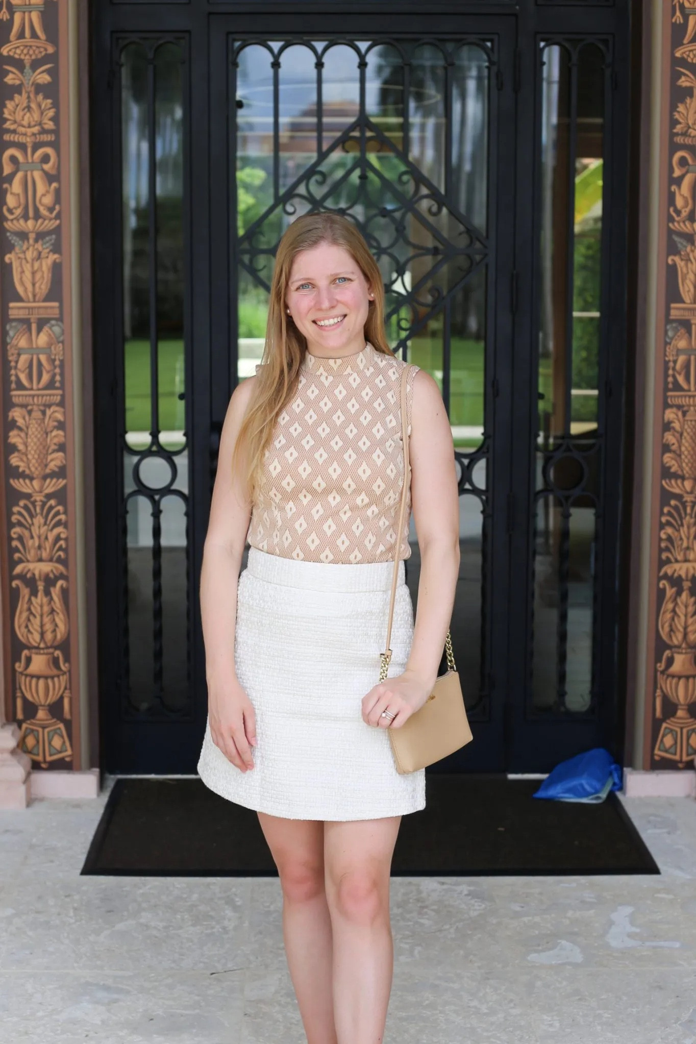 Chic early fall/ Florida fall outfit idea. Printed mock neck tank top and tweed textured white skirt  
