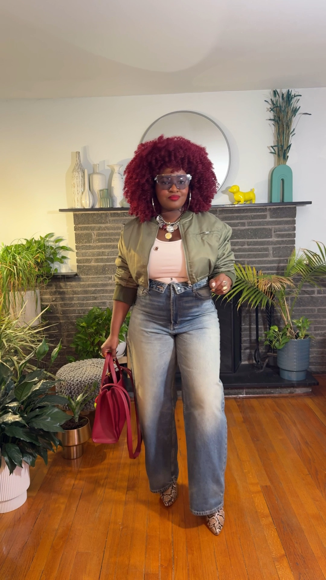 It's a bomber jacket, tank, and jeans kind of day—my wardrobe essentials! When I need to head out quickly, these pieces are my go-tos, always coming together in an effortlessly cool look. Of course, I added my twist with a cropped bomber, an embellished tank, and jeans with a flipped waistband. For extra flair, I threw on my favorite snake print booties and layered my necklaces, bracelets, and rings.

#LTKStyleTip #LTKMidsize #LTKFindsUnder100