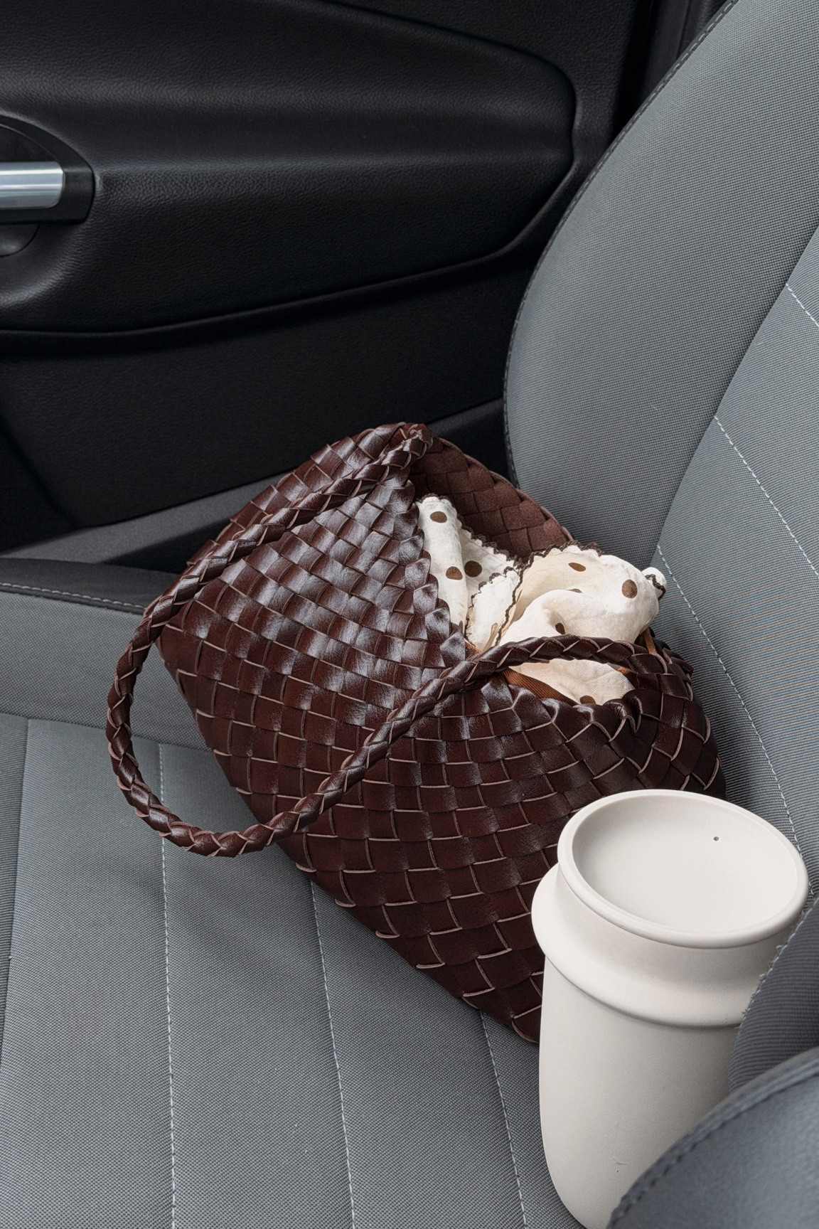Brown woven leather bag and space tumbler by bink

#LTKootd #LTKMothersDay #LTKgrwm