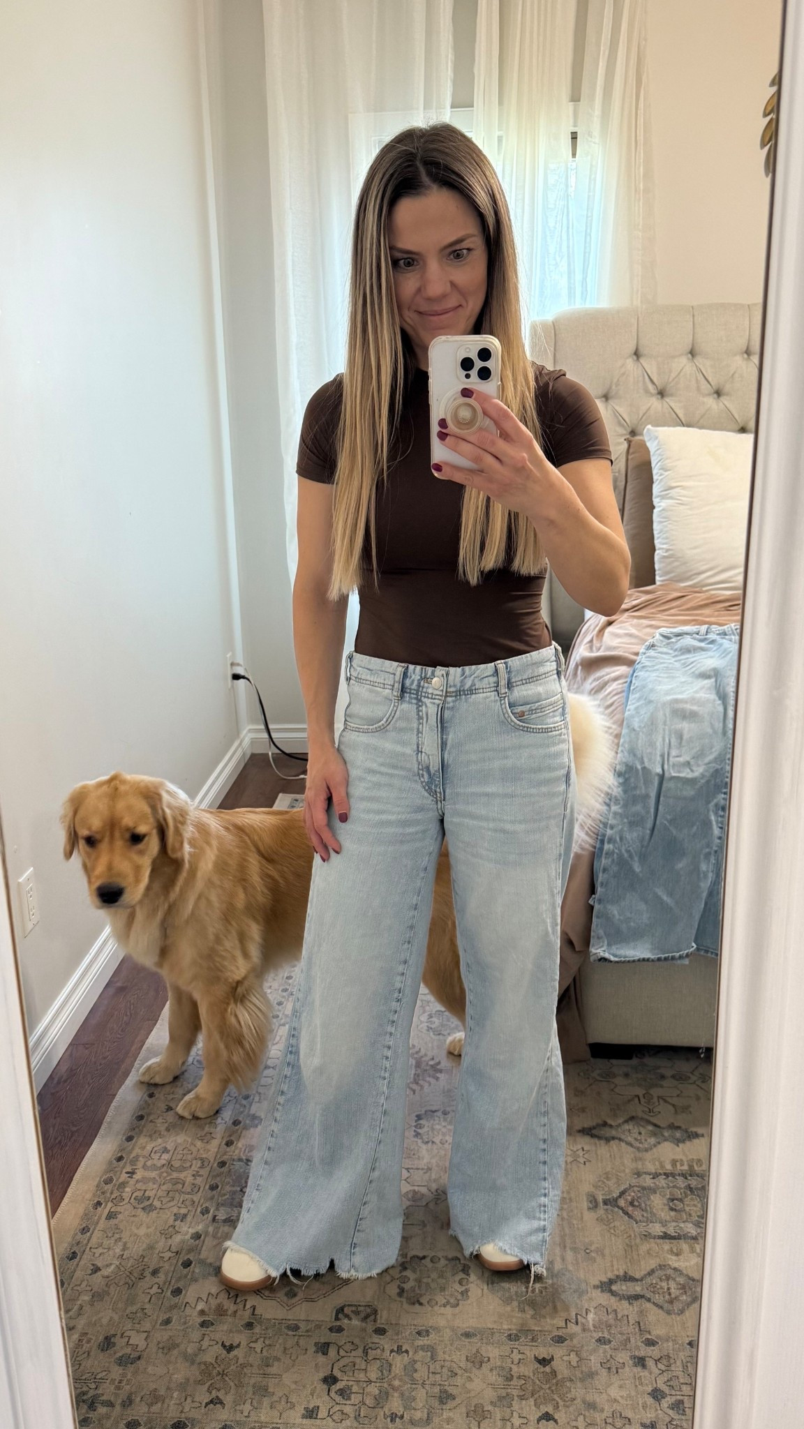 Tee is true to size. Jeans fit very big -
I sized down from my usual 26 to a 24 and still have room.