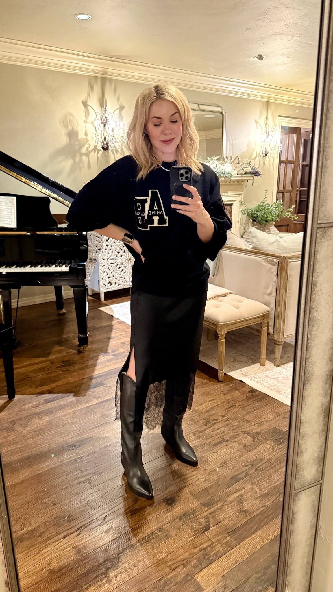 Anine Bing sweatshirt 
Lace skirt
Western boots 

#LTKSeasonal #LTKFindsUnder50