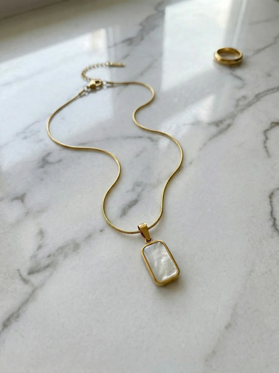 THE GEMINI SHELL NECKLACE IN GOLD (REVERSABLE, WATERPROOF, 18K GOLD PL | raëliv