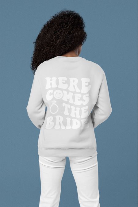 The perfect bridal sweatshirt for the most special day! S-5XL Click below to shop 🤍 Follow me for daily finds! ✨ #wedding #bride #bridal #bridesweatshirt #bachelorette #etsy 
 
This would be the perfect gift for: 
• a future bride to be
• a bachelorette party
• an engagement
• Valentines Day 
• Picking the perfect dress
• Wedding related events 
• And More 


Here comes the bride, sweatshirt, crewneck sweatshirt, women’s sweatshirt, bride, bridal, bachelorette, bachelor, bachelorette party, wedding, wedding outfit, wedding attire, bride sweatshirt, bridal sweatshirt, mrs sweatshirt, wedding sweatshirt, wifey sweatshirt, wedding shirt, couple sweatshirt, mother of the bride, bride to be shirt, couples sweatshirts, gift for her, Valentine’s Day, engagement, sister of the bride, wedding gift, engagement gift, engagement sweatshirt, fiancé, fiancé sweatshirt, fiancé gift for her, bride wedding gift, aesthetic sweatshirt, 2023 bride, bride 2023, wedding announcement, engaged shirt, wedding party 

#LTKwedding #LTKstyletip #LTKSale #LTKGiftGuide #LTKFind #LTKU #LTKsalealert #LTKcurves #LTKtravel #LTKunder50 #LTKunder100 #LTKfamily
