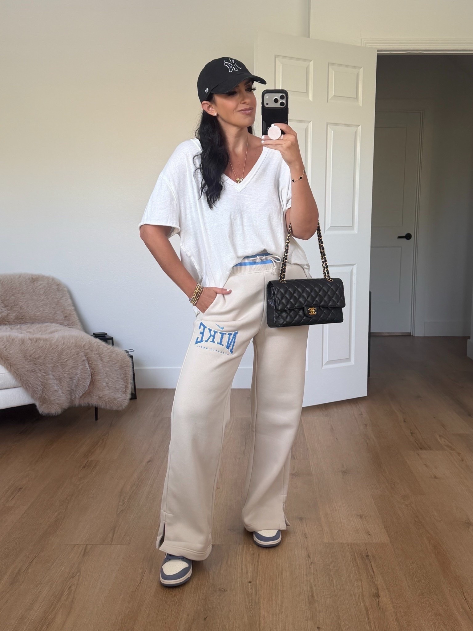 Nike sportswear phoenix fleece women’s high waisted wide leg pants wearing size small 

Free people white oversized tee wearing size xs