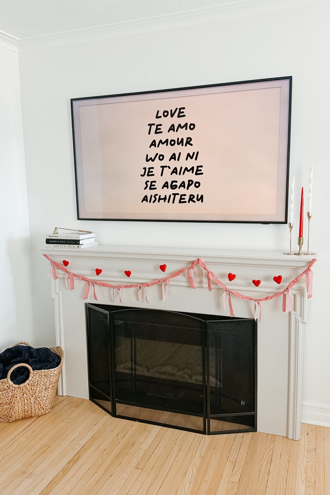 Valentine mantel with layered garlands, candles and books  

#LTKcanada #LTKcasa