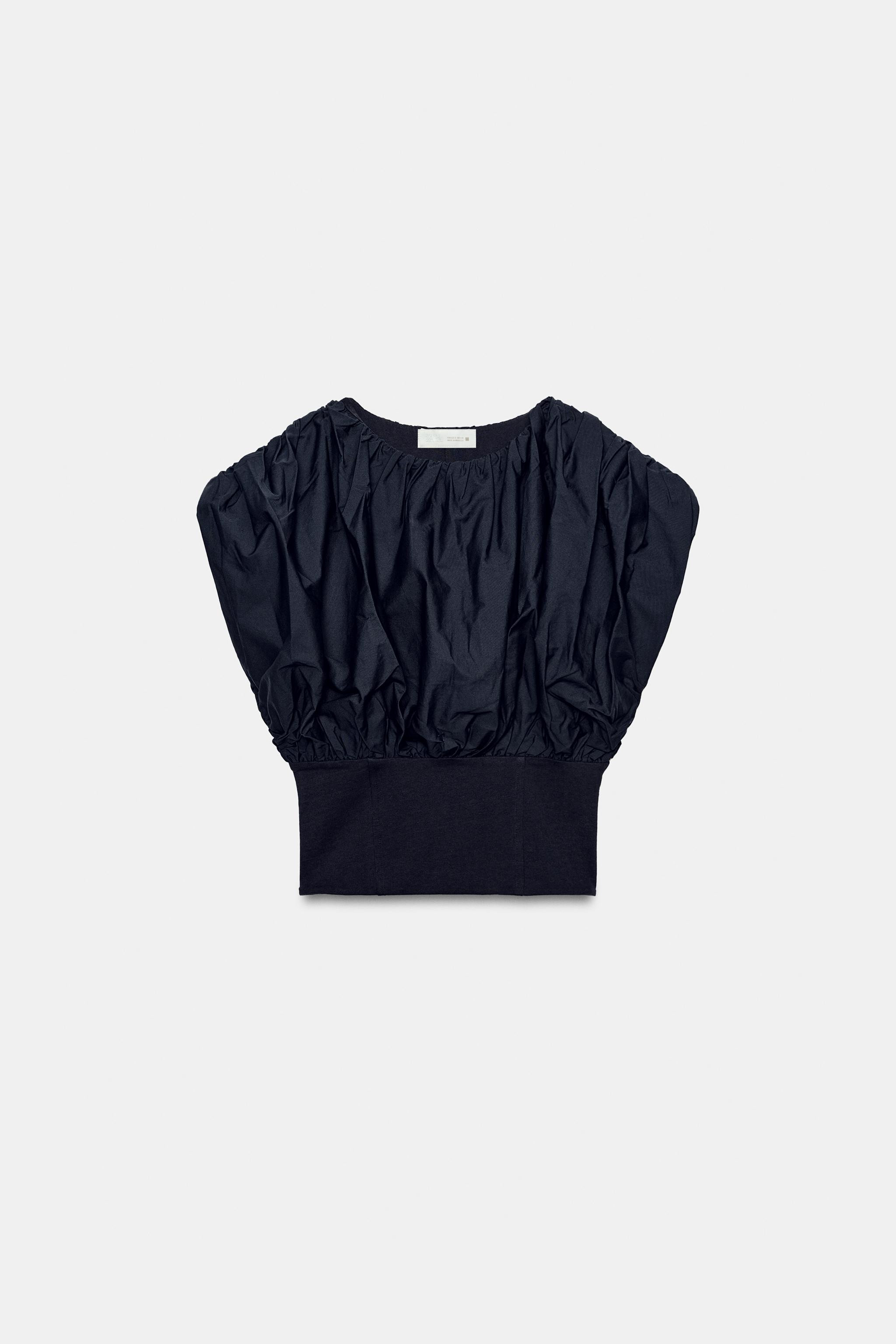 Top crafted from cotton yarn. Featuring a round neck, sleeveless design, straight hem and zip fas... | Zara UK