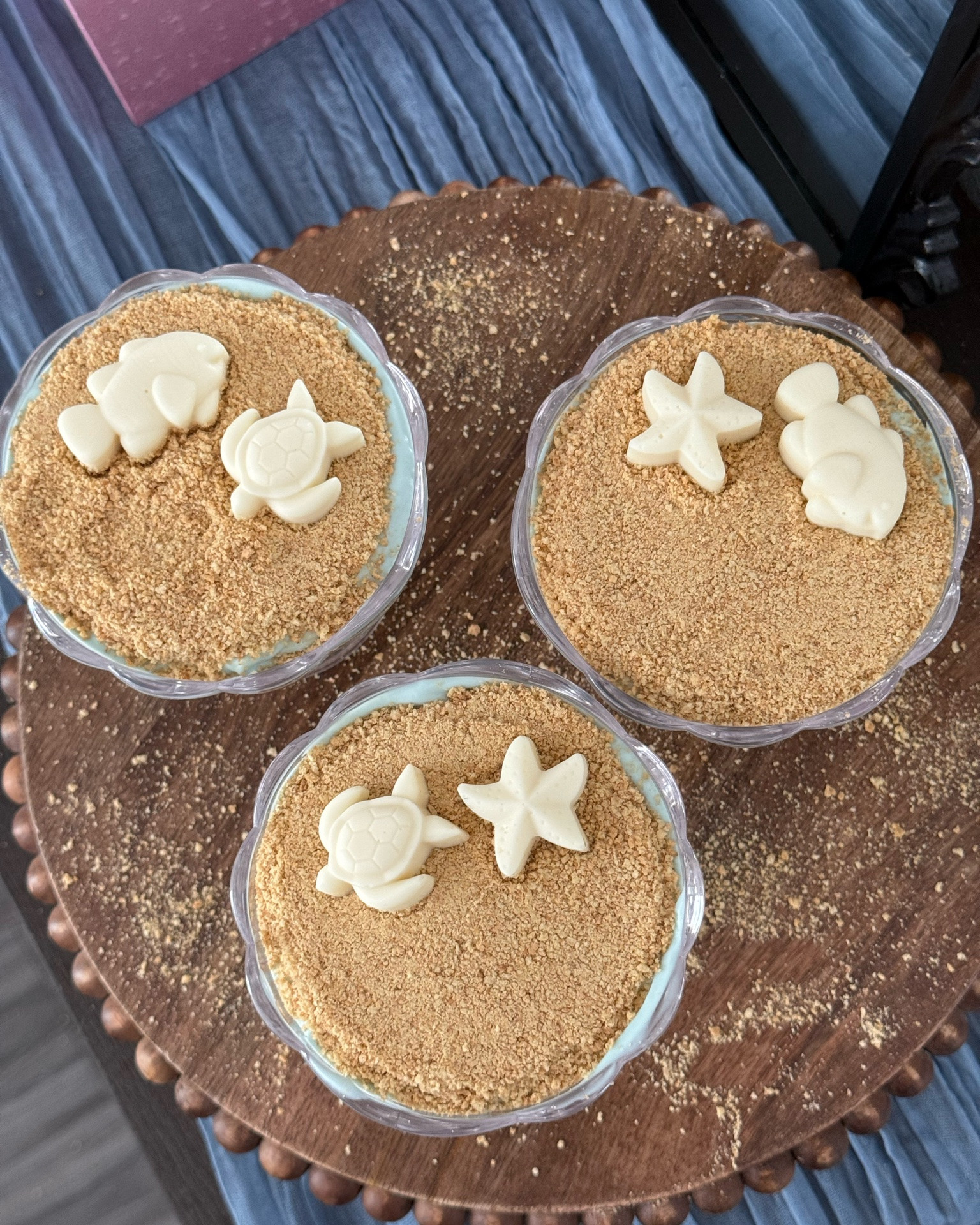 Just LOVE this summer dessert idea. Here’s the details….

pretty summer dessert — just 3 ingredients & ready in minutes 🐚⏱️

what you need: crushed graham crackers, no bake cheesecake, and white chocolate
I added natural blue food dye to make the cheesecake look like the ocean and made the white chocolates using an ocean themed chocolate mold
If you’re using a mold — the chocolate only needs to be in the freezer 7-10 minutes before addjng to the top of your desserts 
I would put these in the freezer for 5 minutes before serving so they are super chilled — sooo good AND look so pretty when serving

save to try this summer and send to someone who would love this ✨

#LTKfoodie #LTKSeasonal #LTKHome