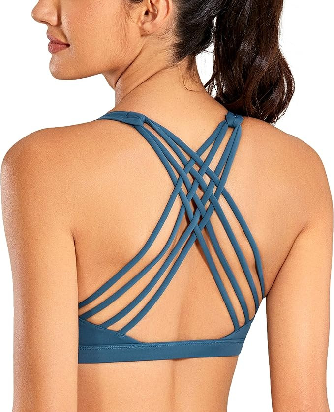 CRZ YOGA Strappy Sports Bras for Women - Criss Cross Back Sexy Wireless Padded Yoga Bra Cute Work... | Amazon (US)