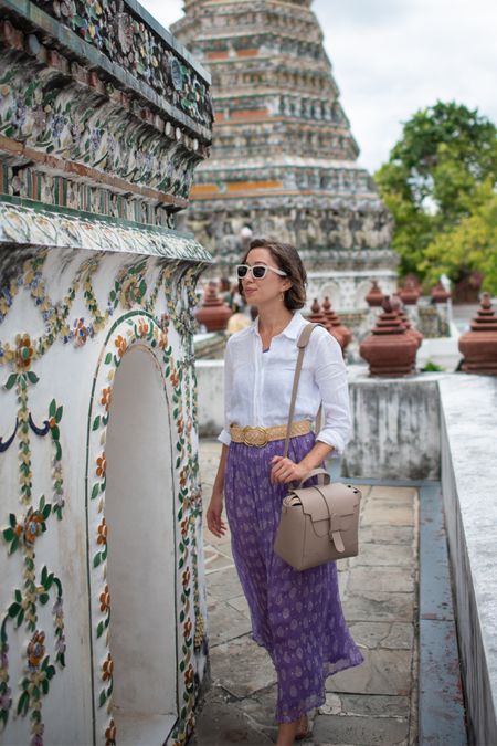 At Wat Arun in Bangkok, Thailand ✨

You have to cover your shoulders and wear pants or a skirt that isn’t too short—I highly recommend a loose button-down layered over a dress with a long skirt. It’s modest, plus you can take the shirt off afterwards!

(If you aren’t dressed appropriately and show up at the temple, don’t fret—you can rent sarongs and loose pants/shirts to cover up for less than a dollar per item).

Bag @senreve // get $50 off at senreve.com/theprimpysheep

#travel #thailand #modestfashion #senreve #asia

#LTKitbag #LTKstyletip #LTKtravel