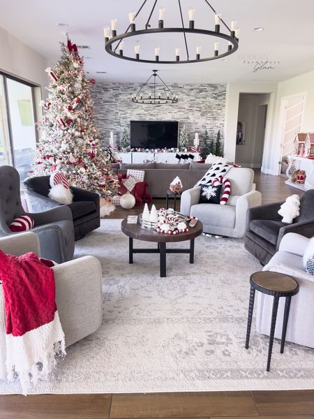 Christmas decorations and tree, furniture, swivel glider chair, lighting and rug in home of Modern Farmhouse Glam

#LTKCyberWeek #LTKHoliday #LTKhome