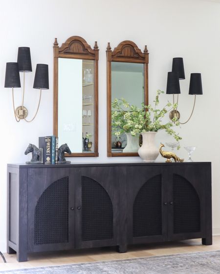 Sale alert on this black rattan arch sideboard! This piece is stunning quality, and is so good paired with a large statement sconce like these which are also on sale!

console decor, styling, entryway decor, hallway, credenza, media console, TV console

#LTKhome #LTKstyletip #LTKsalealert