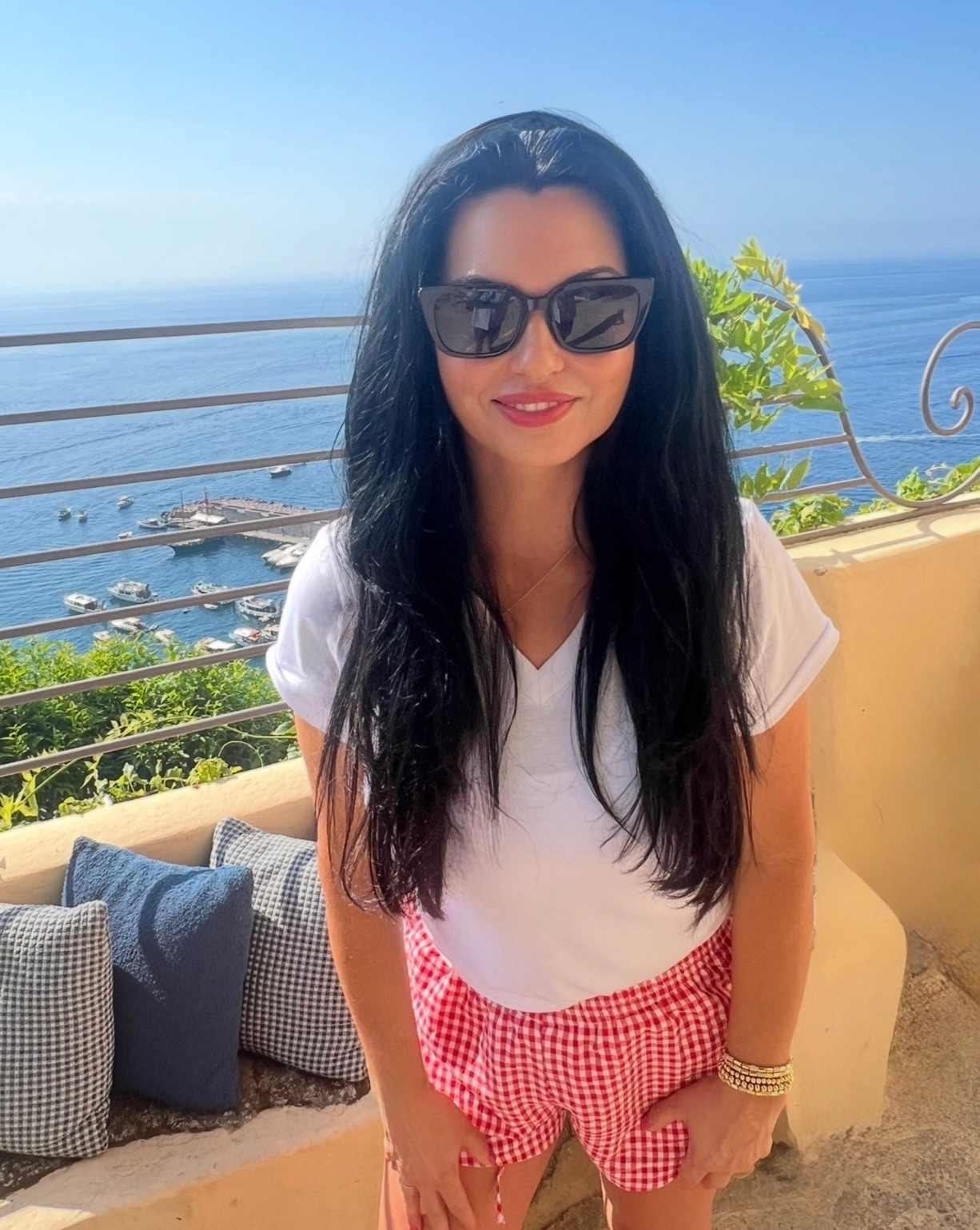 Warm weather vacays call for “beach vacation outfits!” ❤️

A classic white t-shirt and gingham red shorts paired with tan sandals give off a resort wear 2026 vacation vibe!

#marneystidbits #whitetop #shorts #sandals #springoutfit





#LTKSpringSale #LTKootd #LTKTravel