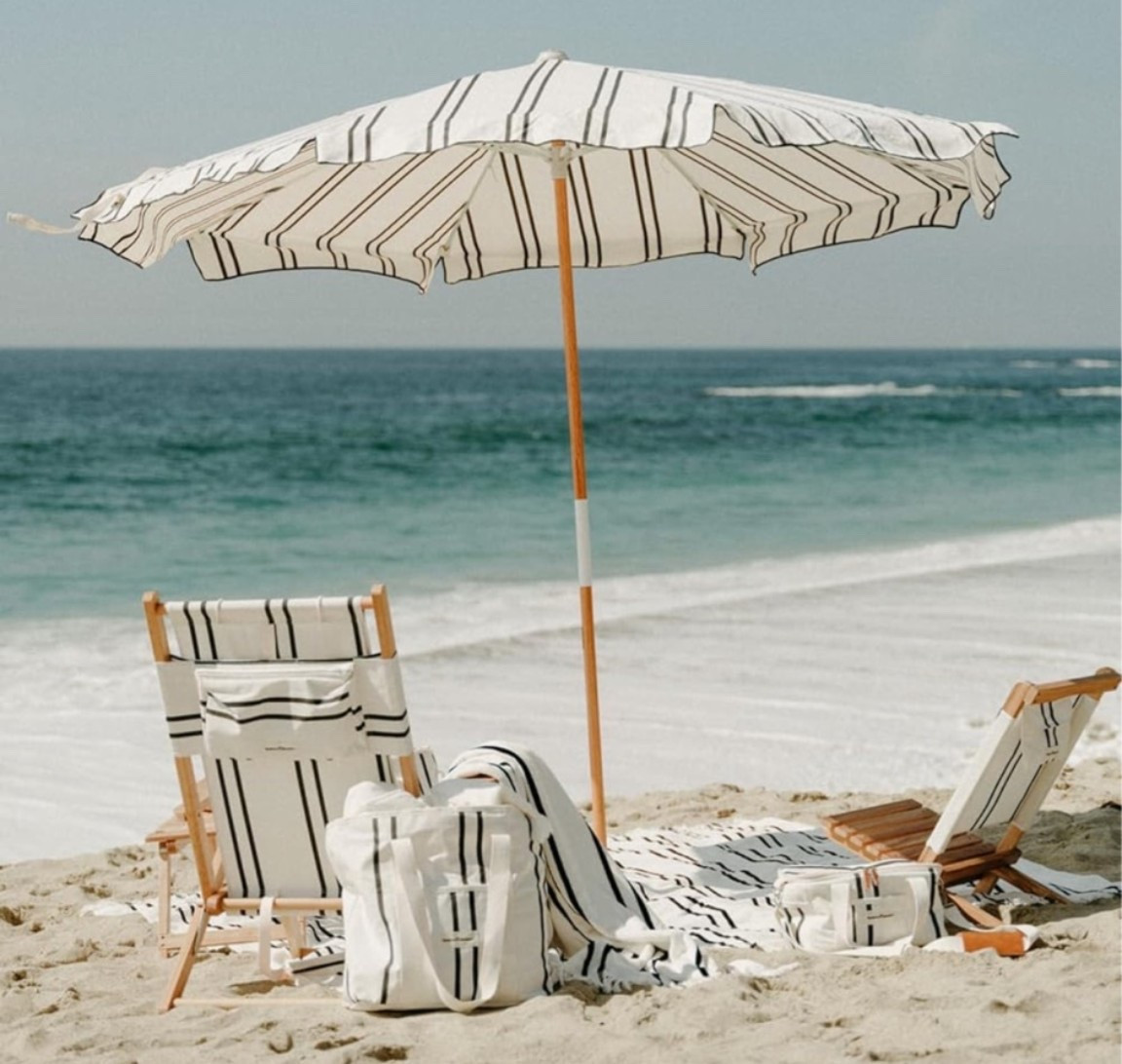 The beach umbrella that looks straight out of a luxury resort on the Amalfi Coast. ☀️🌊 Beautifully designed with timeless coastal style, this umbrella instantly elevates beach days, lake trips, coastal vacations, and afternoons spent by the water. Lightweight yet sturdy with UPF 50+ protection, it's as practical as it is beautiful. 

The kind of beach essential that transforms a simple day in the sun into a picture-perfect summer experience. 🤍

#LTKTravel #LTKSwim #LTKHome
