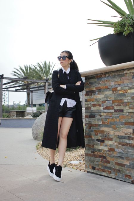 A complete black and white look featuring my new suede platform sneakers from J/Slides! It’s been raining quite frequently in San Diego but when the sun came out, I immediately took these out for a spin! I created a look that complimented my shoes with a sheer collar button down, cropped sweater vest, leather shorts and a midi length tweed coat. 

#LTKshoecrush #LTKfindsunder100 #LTKstyletip