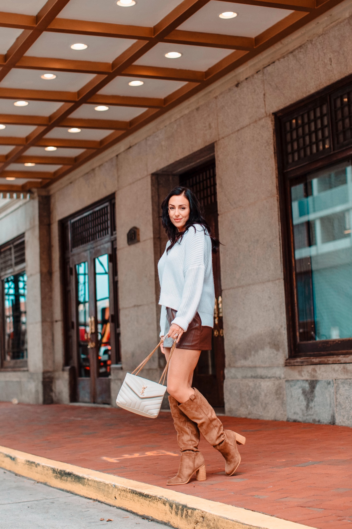 Outfit for a fall night out featuring a sweater from A&F, leather mini skirt, YSL designer bag and knee high brown boots

#LTKSeasonal