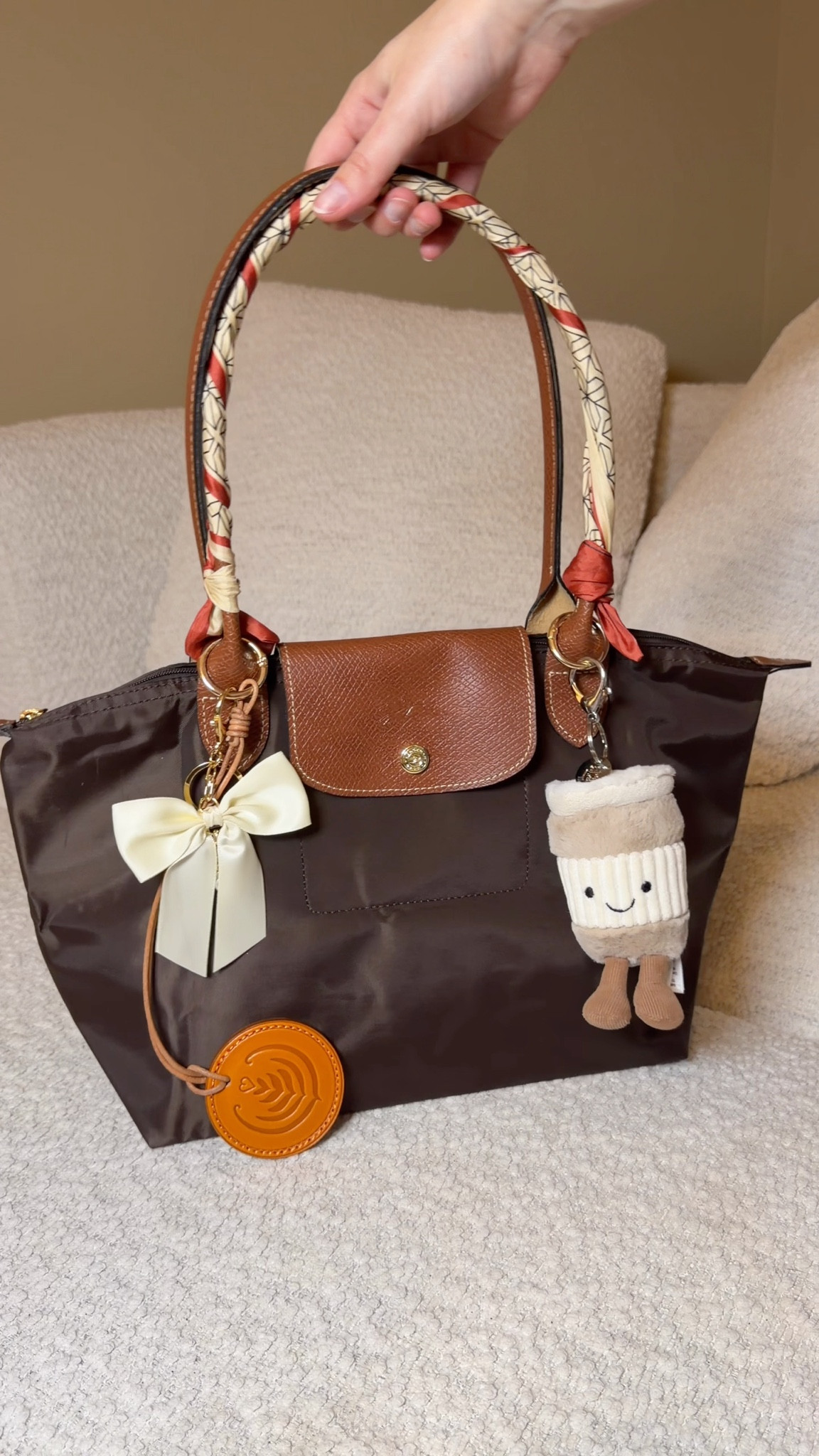Longchamp inspired tote under $30! Loving this cute brown nylon tote indeed and made it coffee themed with a leather latte bag charm, a jelly cat to go coffee cub amusablw charm (back in stock)! And my favorite twilly scarves for bags

#LTKGiftGuide #LTKFindsUnder50 #LTKItBag