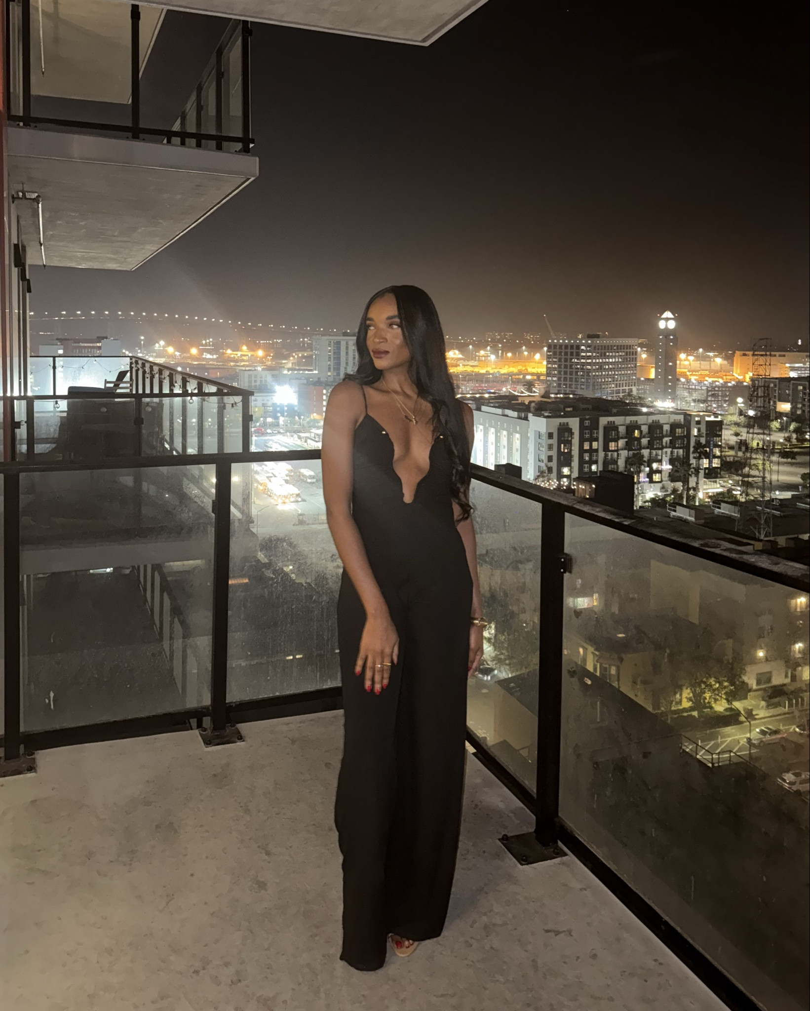 Black jumpsuit with unique neckline. 

#LTKHoliday #LTKSeasonal #LTKStyleTip