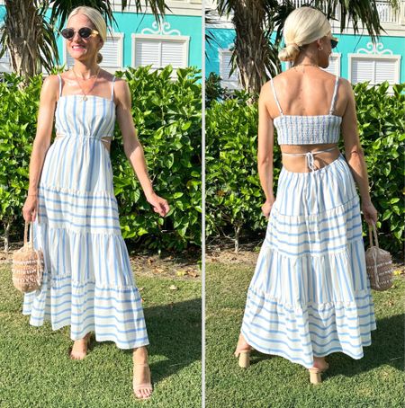 Blue and white stripe dress has a cut out detail. Tie detail in the back. Straps are adjustable. Dress is lined to the knees. Lightweight and flowy. 

#LTKStyleTip #LTKFindsUnder100