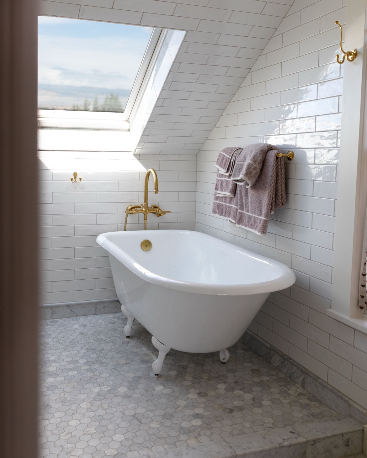 Highly recommend a cast iron clawfoot tub under a skylight 🤍

The Hill House ensuite bathroom

Find all the details on www.thegritandpolish.com

#LTKHome