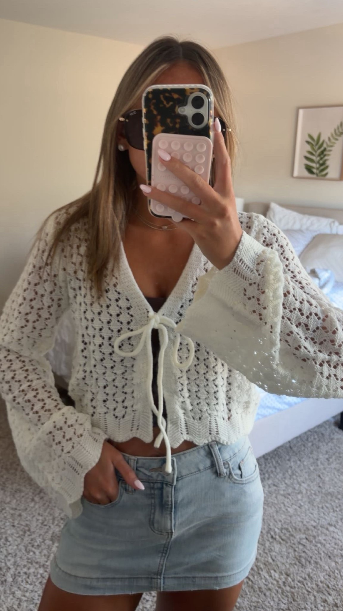 fall outfit inspo that is giving all the cozy, cute fall vibes! the white crochet cardigan with the little tie-front detail looks so pretty layered over a brown tank and paired with a denim skirt. finish the look with boots, sunglasses, and your favorite everyday purse. this is the kind of outfit you can wear to a pumpkin patch, out to lunch, on a fall shopping day, or anywhere you want a cute seasonal look!

#LTKfall #FallOutfitInspo #LTKStyle #AmazonOutfits #PumpkinPatchStyle #FallFashionFinds #AffordableFashion #DenimSkirt 

 #LTKdayinmylife #LTKootd #LTKSeasonal