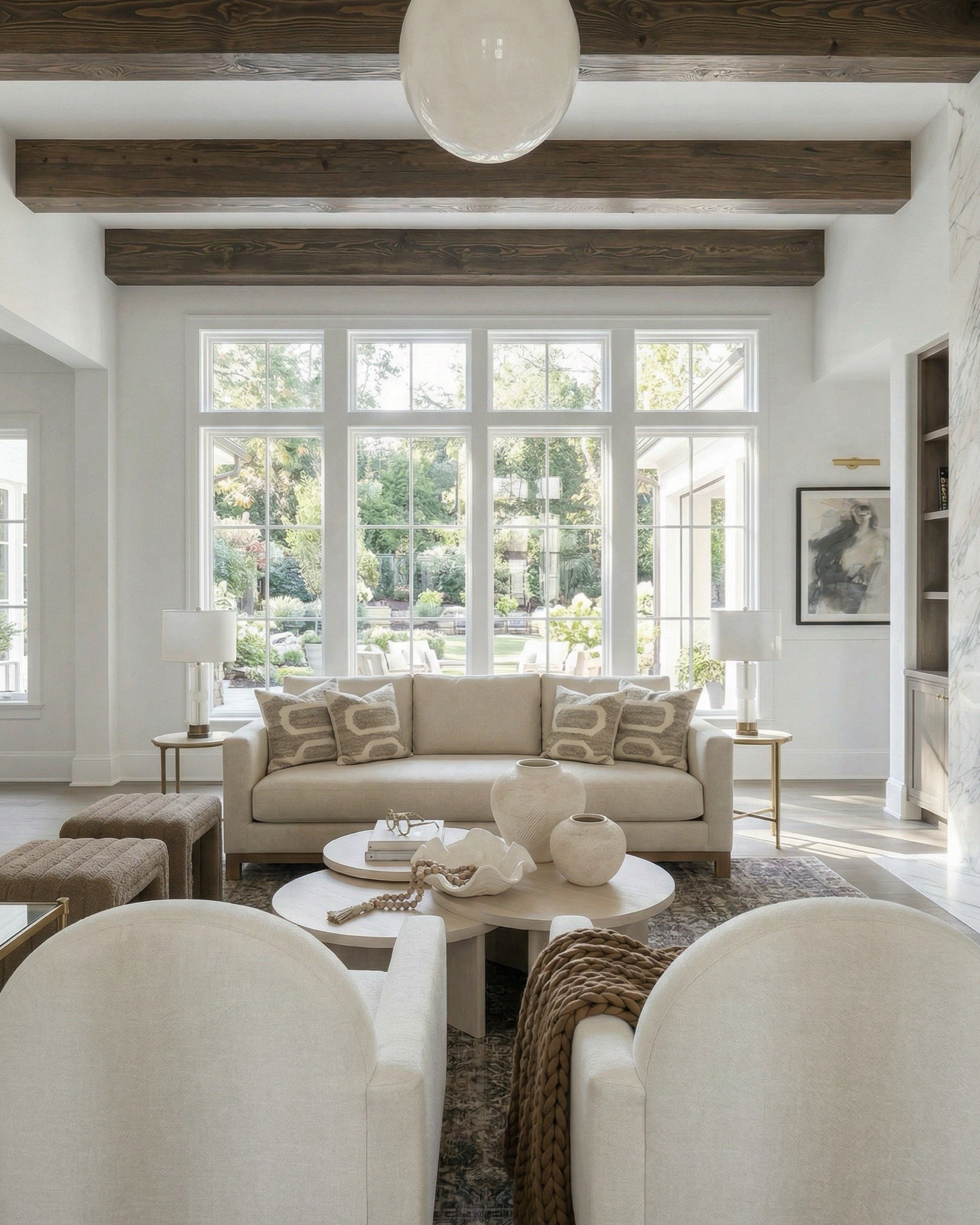 Shop the look:
• Cream upholstered sofa / neutral fabric couch • Ivory boucle accent chairs • Round light wood coffee table • Textured boucle ottomans / foot stools • Vintage distressed area rug (neutral patterned rug) • Marble slab fireplace wall / stone fireplace design • Custom built-in shelving / wood built-ins • Decorative vases (ceramic + sculptural decor) • Coffee table books + tray styling decor • Wood console table (rustic entryway table) • Upholstered bench / small stool • Brass table lamp with patterned shade • Glass + brass side table • Framed abstract wall art (neutral artwork) • Wall sconces with globe lighting • Olive branch stems / faux greenery • Woven throw blanket / textured throw • Decorative beads / bowl accents

#LTKhome #LTKsale #LTKstyletip