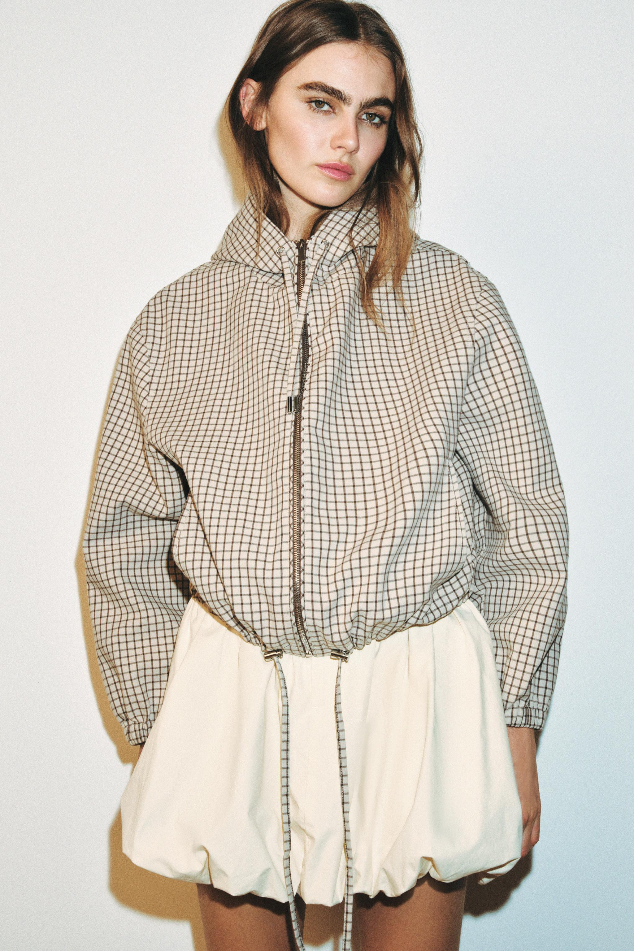 Jacket with a high collar and adjustable drawstring hood. Featuring long sleeves with elasticated... | Zara UK