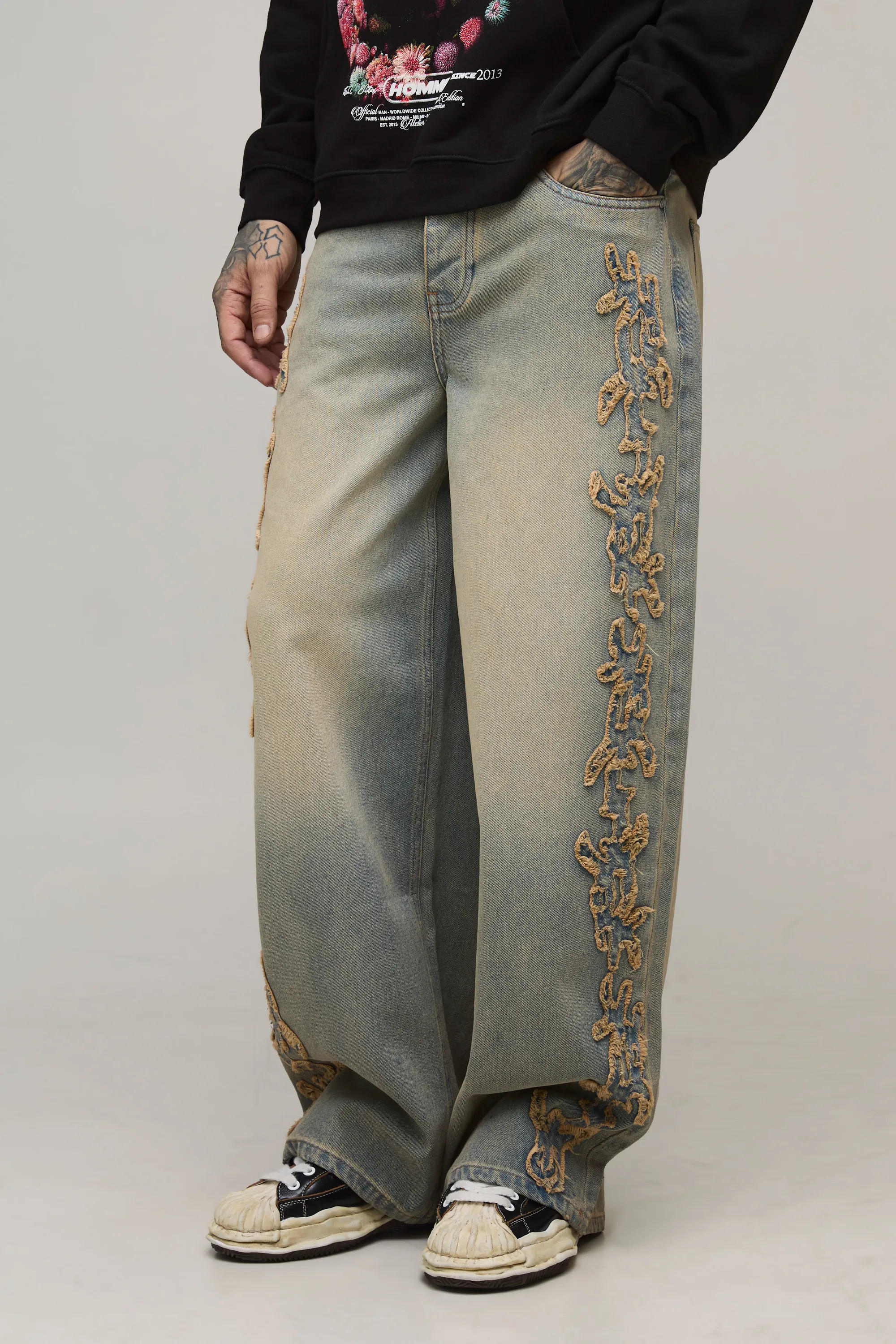 Stonewash Tall Baggy Tribal Distressed Applique Tinted Washed Jeans | BOOHOOMAN | boohooMAN (DE, IE & UK)
