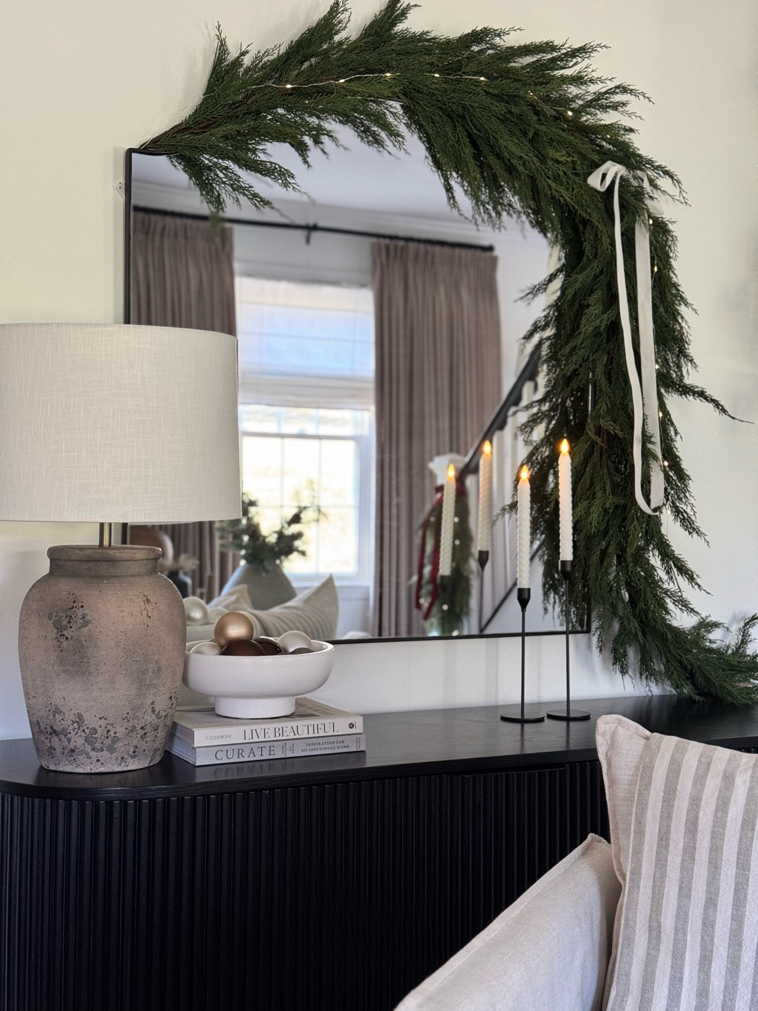 Mirror and garland! Exact cabinet is from Rove Concepts.

#LTKHoliday #LTKHome