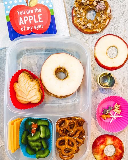 APPLE THEMED FALL LUNCH BOX

This fun lunch box idea combines an apple theme with other elements of Fall like Fall leaves.

“Apple sandwiches” are made by coring an apple and slicing it into rings. Spread peanut butter on each half and sprinkle with granola. 

Create “Green apple” pepper bites by cutting a green bell pepper into large chunks and using an apple shaped fruit and veggie cutter to punch out green apple shapes.

Add some snacks like cheese slices and pretzels and then finish off the lunch with an apple themed lunchbox note. 

Various shaped silicone baking cups keep the food items separate and the 3-compartment bento lunch boxes make packing easy.



Lunchbox 
Bento box 
Lunch box ideas 
Lunch box notes
Lunchbox accessories 

#LTKSeasonal #LTKfindsunder50 #LTKkids
