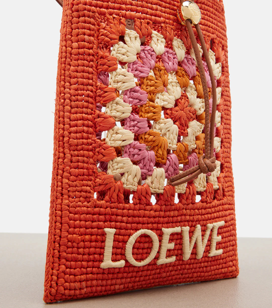 Paula's Ibiza crochet raffia pouch with strap | Mytheresa (US/CA)