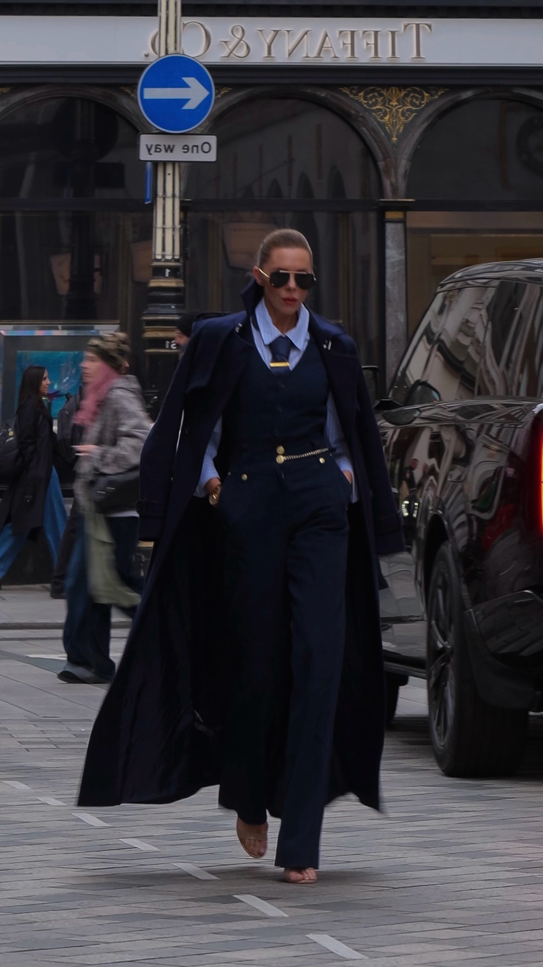 Navy Power Move
Tailored navy waistcoat and matching wide-leg trousers, layered over a crisp blue shirt and tie for a sharp menswear-inspired twist. Finished with a long navy coat, gold chain belt, and nude heels, the ultimate power walk look.#LTKautumn 

#LTKuk #LTKwinter