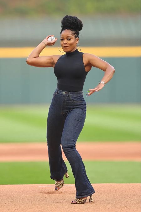 @keke through a pitch at a #baseballgame in a black top, blue jeans, and $995 #ysl Gippy Leopard Slide Sandals. Bomb! Shop her look for less under shop our feed in our bio! 

#LTKFind #LTKSeasonal #LTKunder50
