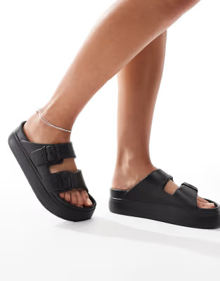 ASOS DESIGN Freestyle flatform double buckle footbed sliders in black | ASOS (Global)