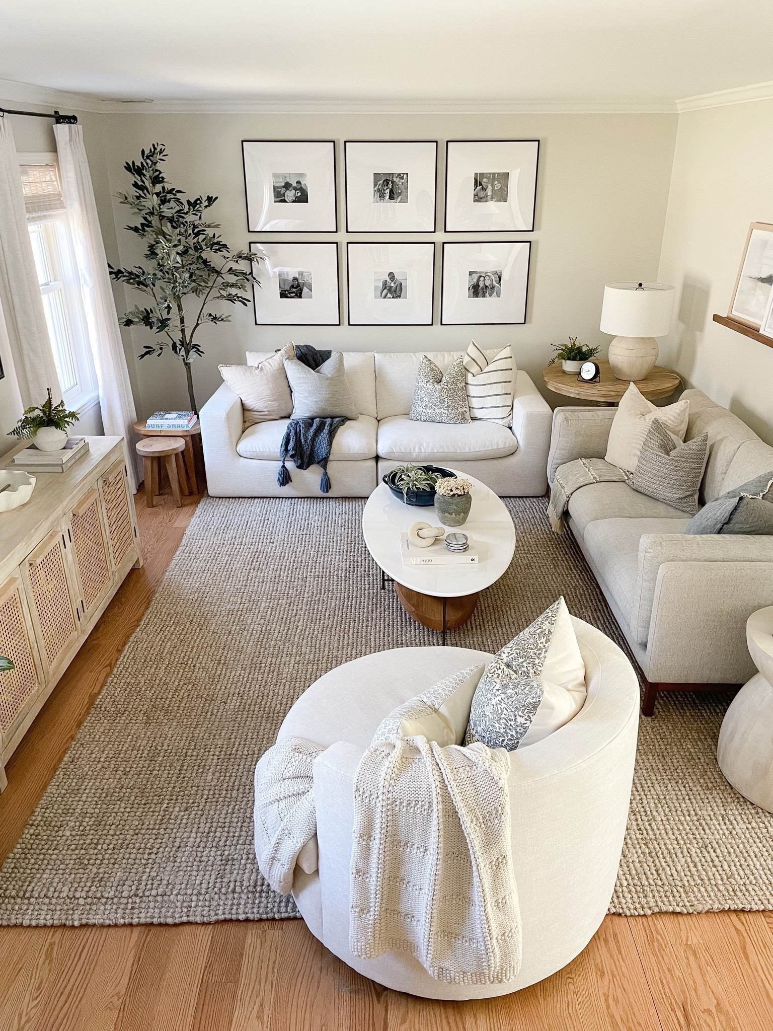 Jute rug, coffee table, media console, throw pillows,  side table, Pottery Barn lamp, olive tree 

#LTKunder100 #LTKhome #LTKstyletip