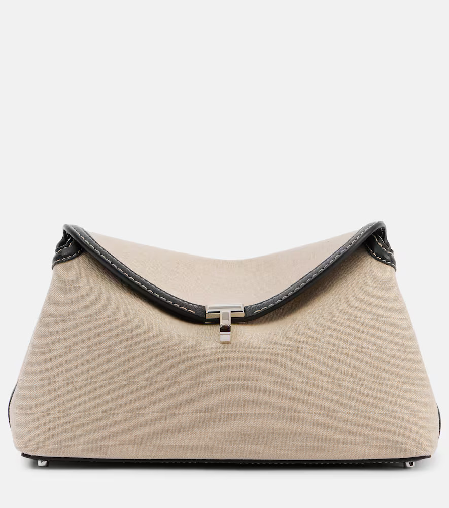 Toteme T-Lock leather-trimmed canvas clutch | Mytheresa (UK)