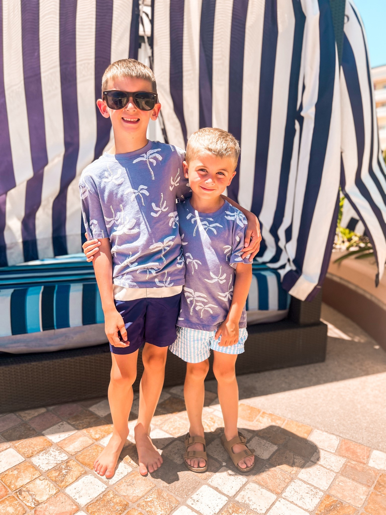 Boys coastal tropical beach vacation outfits
Boys blue striped swim trunks
