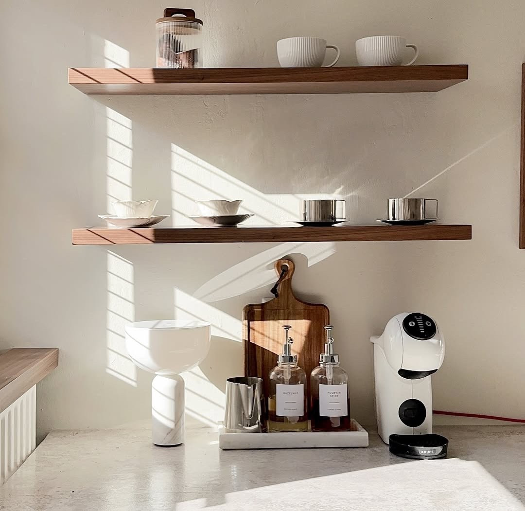 This little coffee corner is proof that small spaces can still feel beautiful and intentional. I styled it with earthy tones, soft textures, and everyday pieces that feel elevated — loving the simplicity of open shelving and that clean, modern coffee machine. Everything you need for a peaceful morning at home is linked on my LTK! #MorningRituals #HomeCafeVibes #LTKFinds

#LTKActive #LTKHome #LTKSeasonal