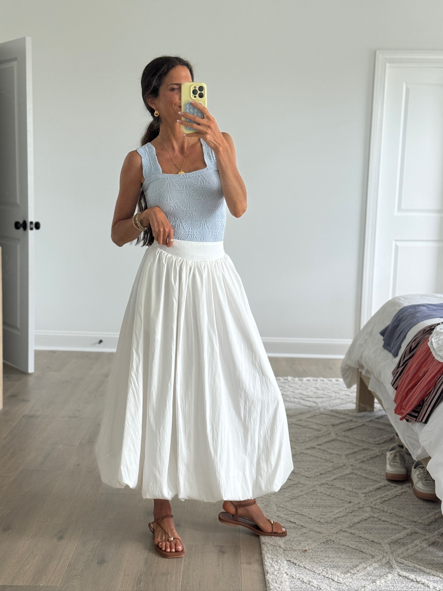 A white midi skirt is one of the most versatile pieces you can own for spring and summer. Pair it with a tank, graphic tee, button-down, lightweight sweater, or denim jacket—the styling possibilities are endless.

#LTKSeasonal #LTKmomlife #LTKgrwm