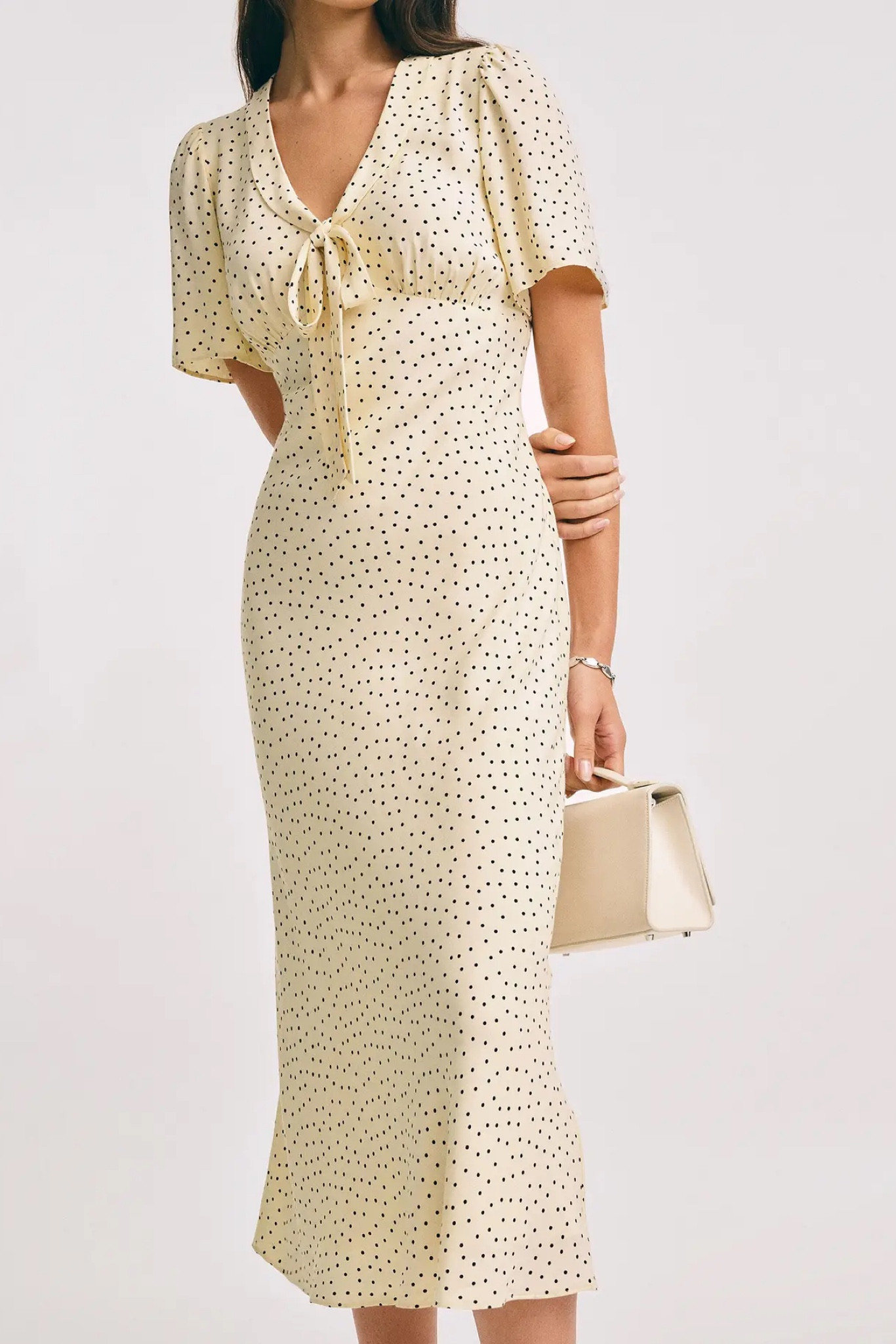 A timeless midi dress featuring a classic polka dot print, flattering silhouette, and comfortable short sleeves. The Tyra Dress is an easy choice for everything from brunch dates to special occasions, offering a polished look with effortless charm. Pair it with sandals for daytime wear or dress it up with heels and statement accessories for an elevated outfit. Lightweight, feminine, and versatile, this is a piece you'll reach for season after season. ✨🤍🖤

Obsessed with this chic polka dot midi dress! The flattering fit, classic print, and easy short sleeves make it perfect for weddings, brunch, vacations, and everyday wear. A timeless wardrobe staple that looks so much more expensive than it is. #LTKStyle #MidiDress #PolkaDotDress #ClassicStyle



#LTKgrwm #LTKdayinmylife #LTKootd
