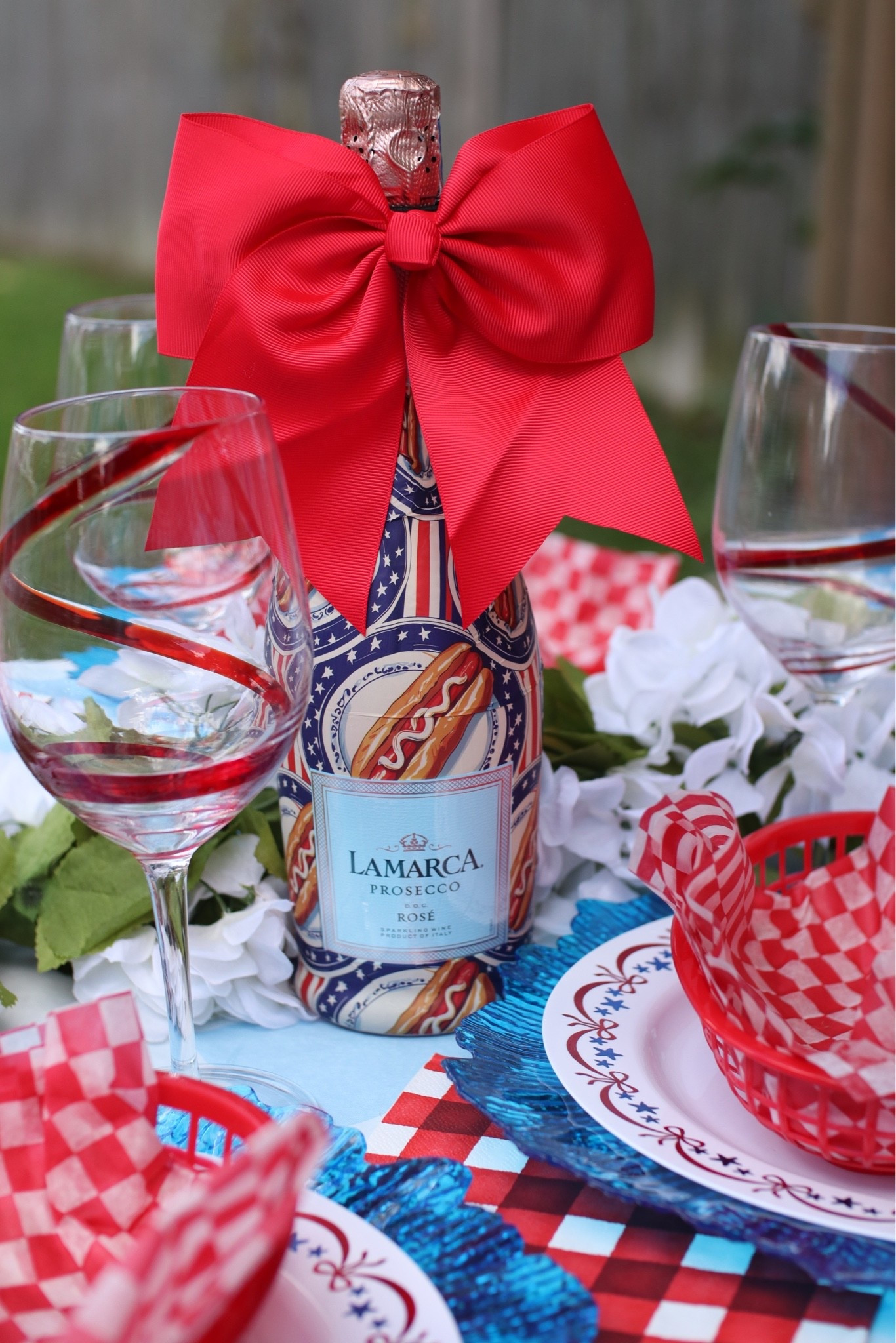 Elevating our Labor Day Picnic Table with Beau Bottles!!! Fun for any holiday or party decor! Dress up your bubbly with @Beau Bottles

#LTKHome #LTKSeasonal #LTKfoodie