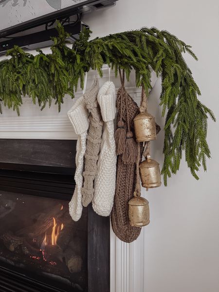 Fireplace mantle holiday decor. 

Neutral Christmas decor, neutral Christmas stockings, garland, Norfolk pine garland, gold bells, fireplace decor

#LTKHoliday #LTKhome #LTKSeasonal