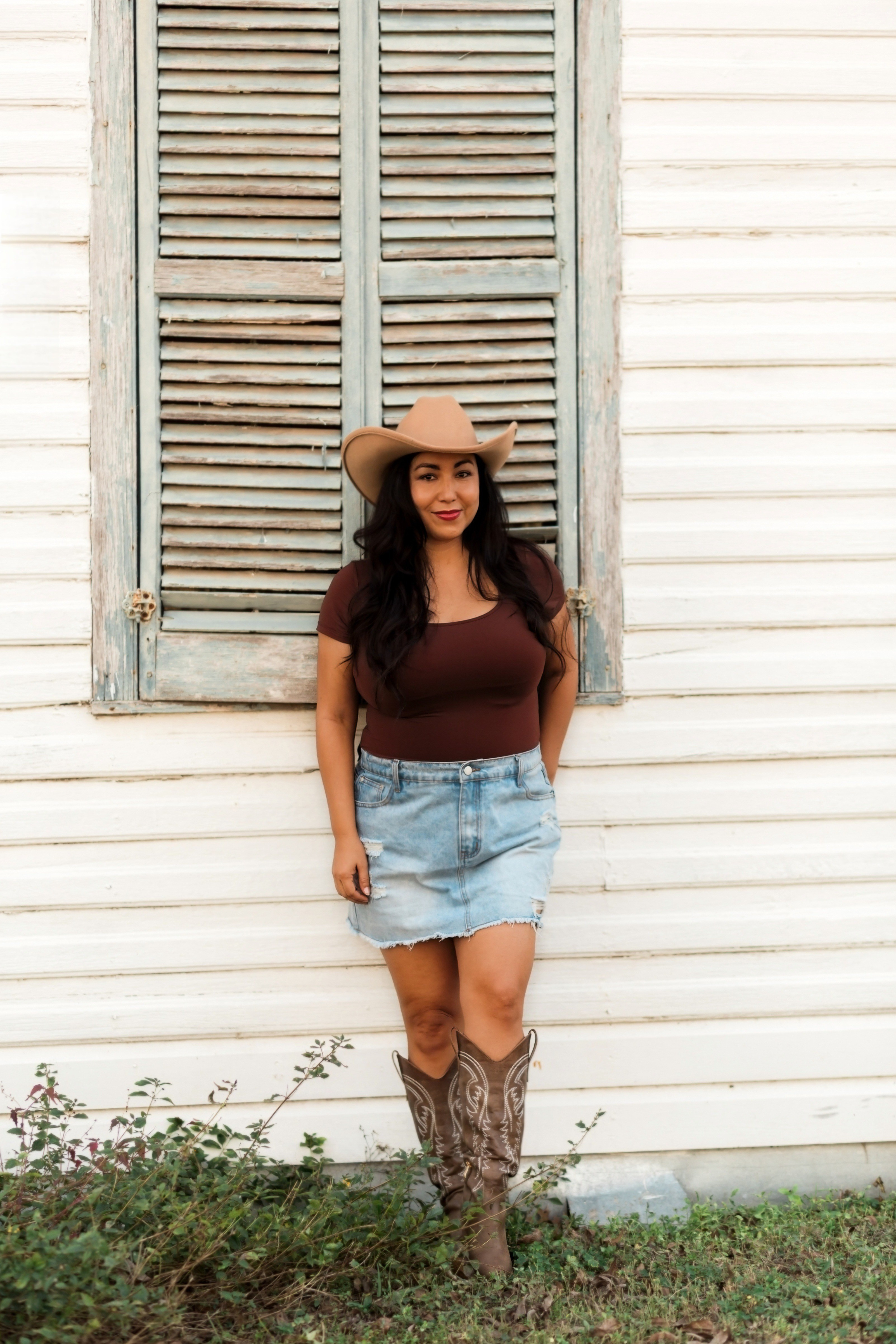 My birthday shoot look! This bodysuit hugs in all the right places and as my favorite bodysuit, i've ever bought. These are my go to everyday cowboy boots. This skirt is actually a scort! Score!!!

#LTKOver40 #LTKMidsize #LTKootd