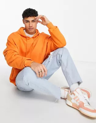 ASOS DESIGN – Übergroßer Kapuzenpullover in Orange | ASOS (Global)