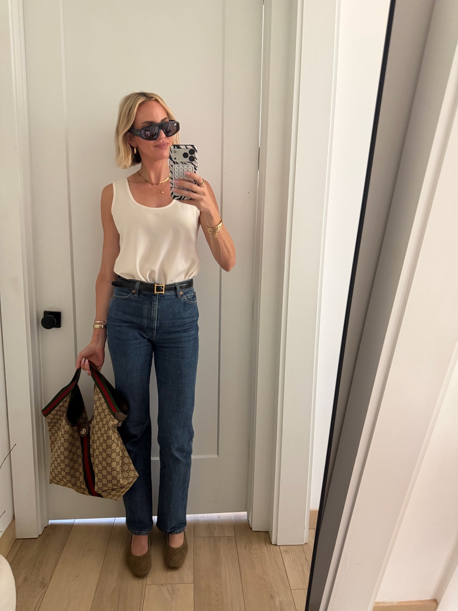 It’s actually getting kind of pathetic how much I’m reaching for this tank😬 I just keep grabbing it because it makes me look expensive without trying. I’m buying it in black as well. I’m wearing a small and jeans run TTS. I also love how the shoes look like botega, but they are definitely not botega ￼￼

@dolcevita

#LTKTall #LTKdayinmylife #LTKOver40
