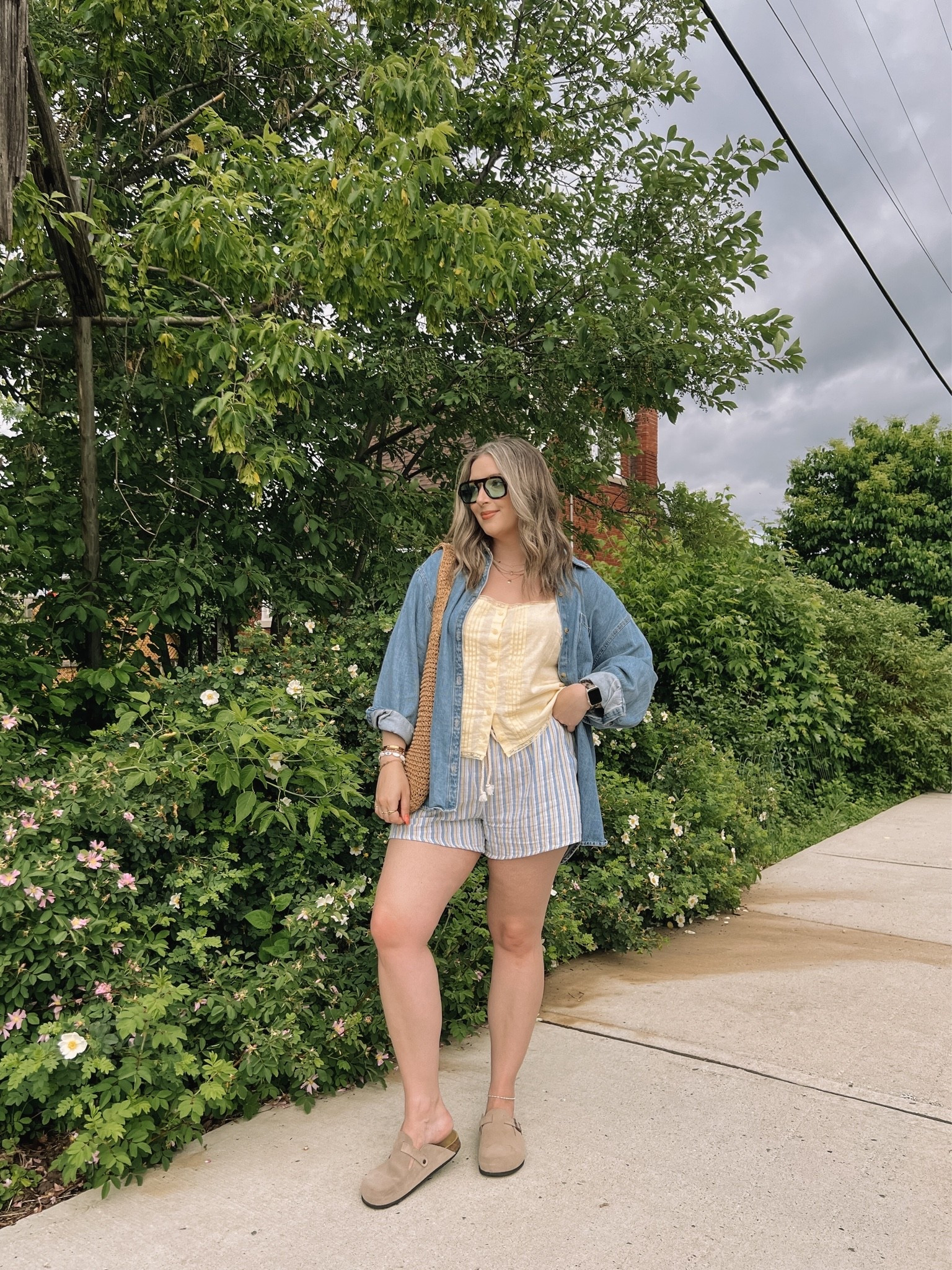 Easy summer outfit! Canadian links are under “similar products”. Wearing my usual size L in the striped shorts, butter yellow tank top, and oversized denim shirt. Straw tote bag is one of my fave Amazon finds! Linked similar clogs

#LTKsummer #LTKmidsize #LTKstyletip