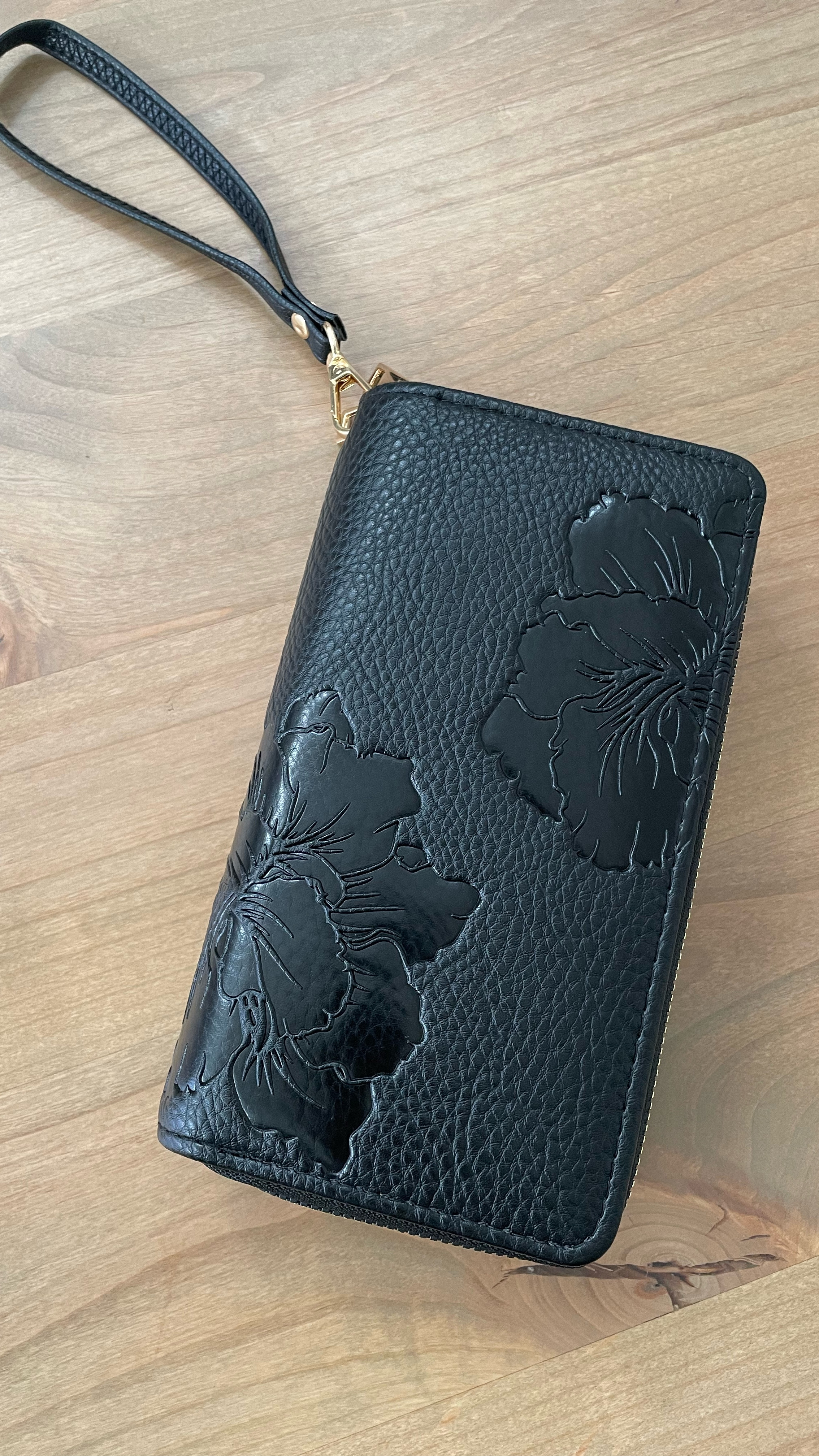Gorgeous black wristlet with two zip compartments. My phone can fit in here along with everything I need. Can be used as a wristlet or wallet. Antitheft material lined to protect your credit cards.

#LTKOver40 #LTKGiftGuide #LTKItBag