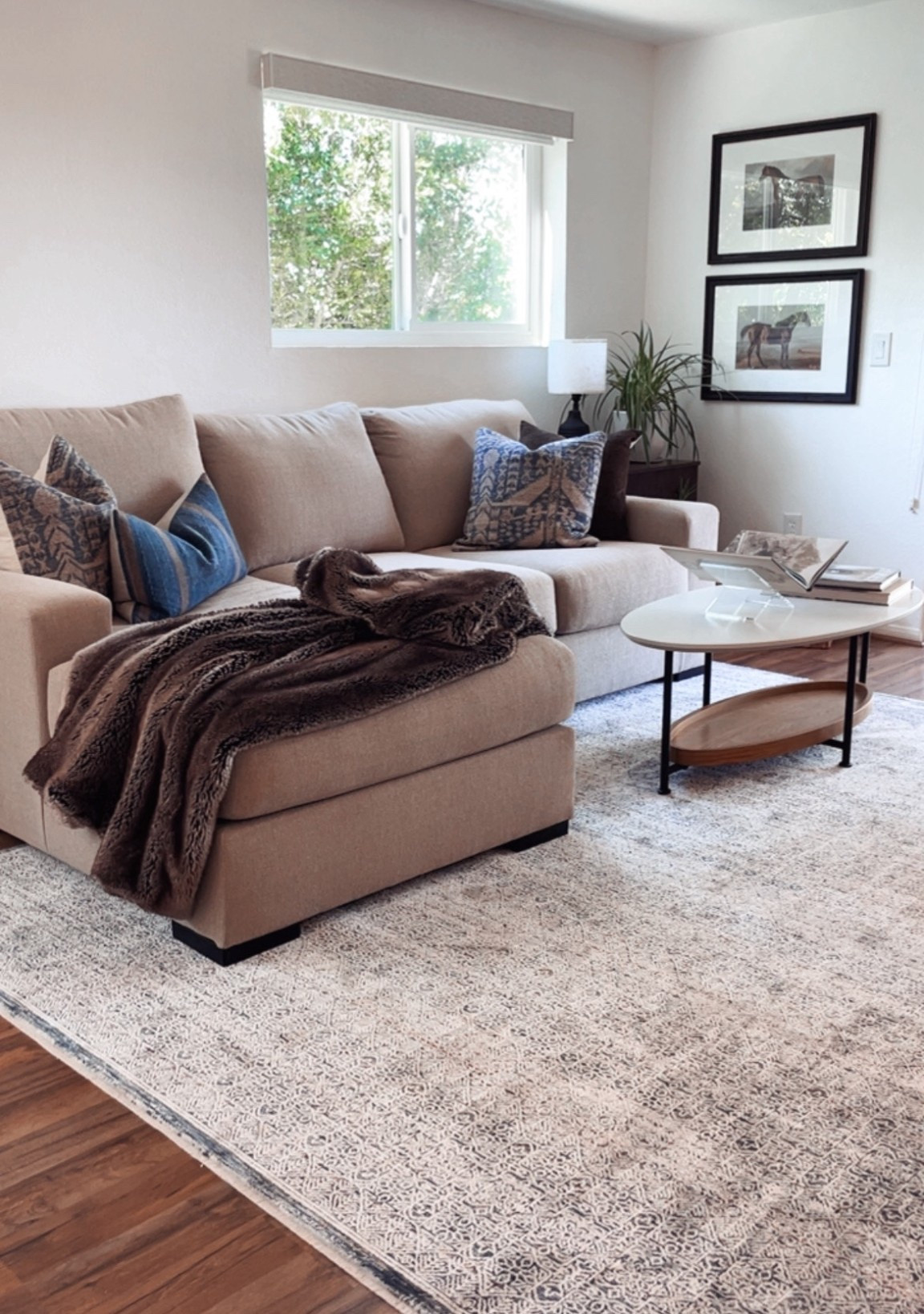 I love how this little cozy corner in my clients living room is turning out! 

This is the Larce Sectional and it’s super comfortable, budget friendly and designer approved. 👍🏻

The oval coffee table here is perfect for a small apartment. 

#LTKSpringSale #LTKHome