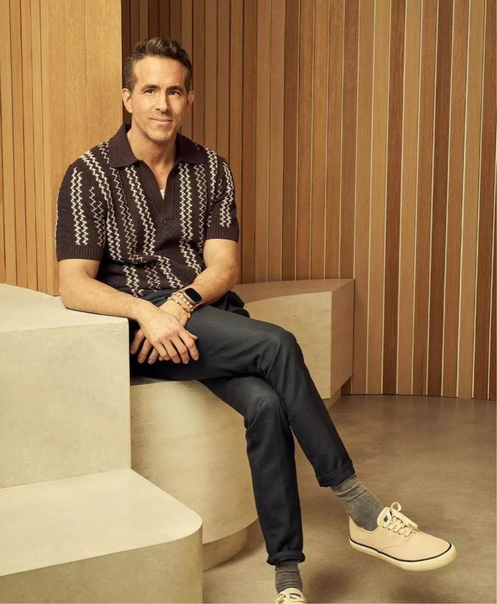 Ryan Reynolds is wearing an embroidered polo, pleated navy trousers, and classic deck sneakers.

#LTKStyleTip #LTKMens