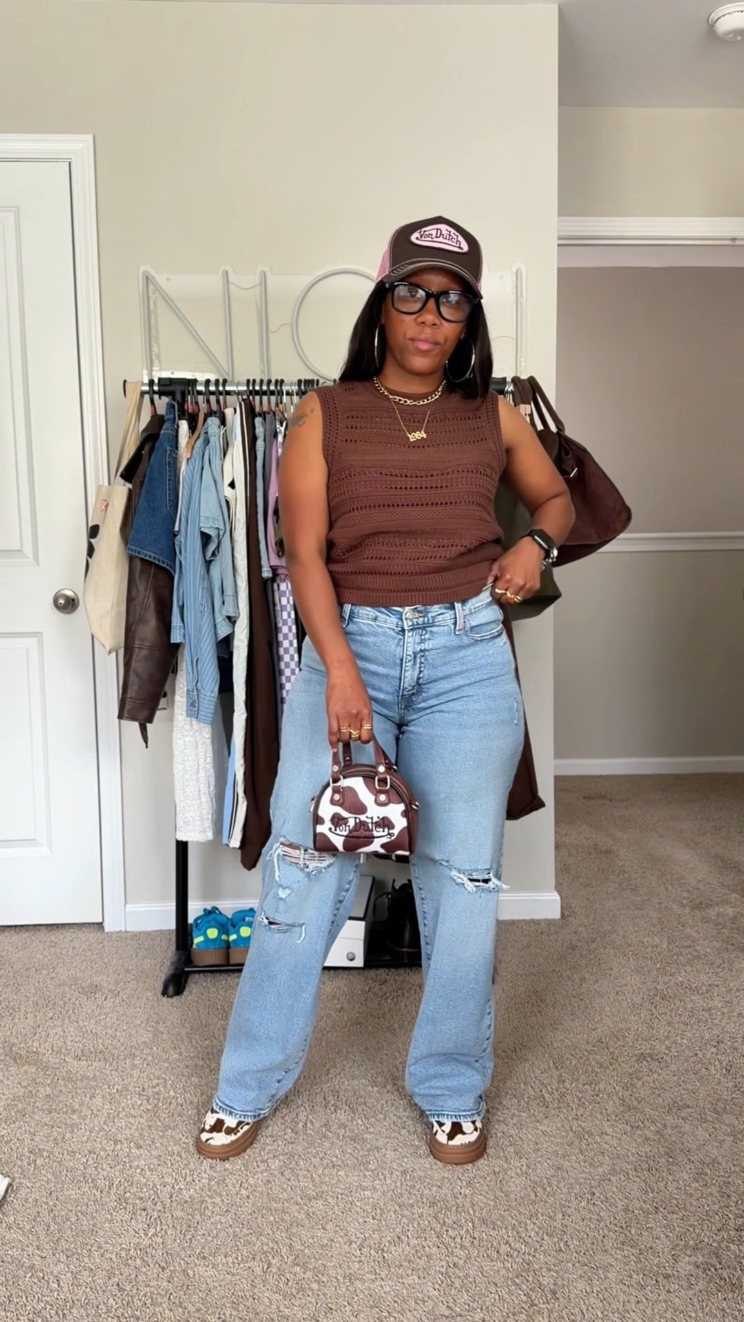 Get dressed with me to go run errands.

I’m wearing a brown sleeveless shirt, high waisted distressed jeans, trucker hat, cow print purse, and cow print sneakers

#LTKPetite #LTKOver40 #LTKootd