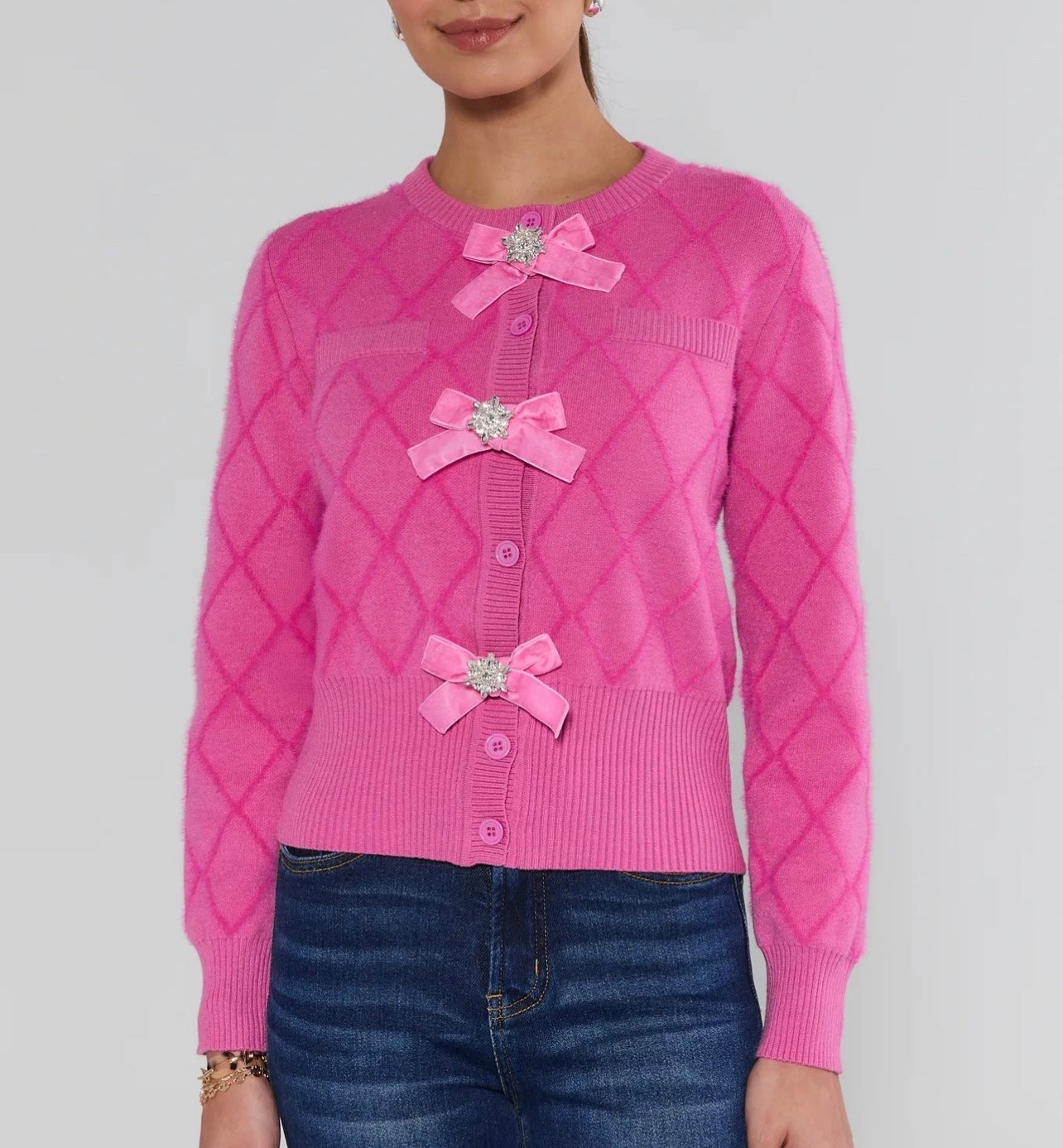 Pink Bow Cardigan with Rhinestone Details 🎀💗

This pink cardigan is such a fun statement piece and perfect for dressing up everyday denim or styling for holiday events. The lightweight knit has a pretty diamond-stitched texture, and the removable velvet bows with sparkly rhinestone centers give it that extra special touch ✨ I love that it buttons all the way down so you can wear it as a top or layer it over a cami. The semi-fitted, hip-length silhouette feels polished without being tight, making it great for office parties, festive dinners, or even a casual girls’ night out. A chic pop of pink that instantly elevates your outfit 💕🎀

Pink cardigan, bow cardigan, rhinestone bow sweater, holiday cardigan outfit, festive pink sweater, women’s knit cardigan, button front sweater, dressy casual cardigan, statement knitwear, boutique sweater style

#LTKGiftGuide #LTKSaleAlert #LTKHoliday